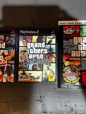 Sony Grand Theft Auto: Assorted Games — Black Game Case; Assorted Game Guides